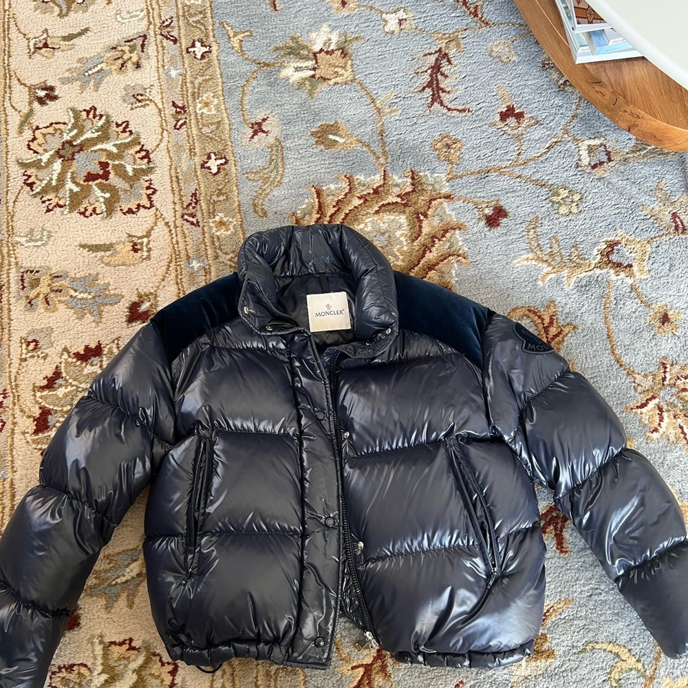 Moncler Blue Puffer Jacket with High Collar and Down Insulation